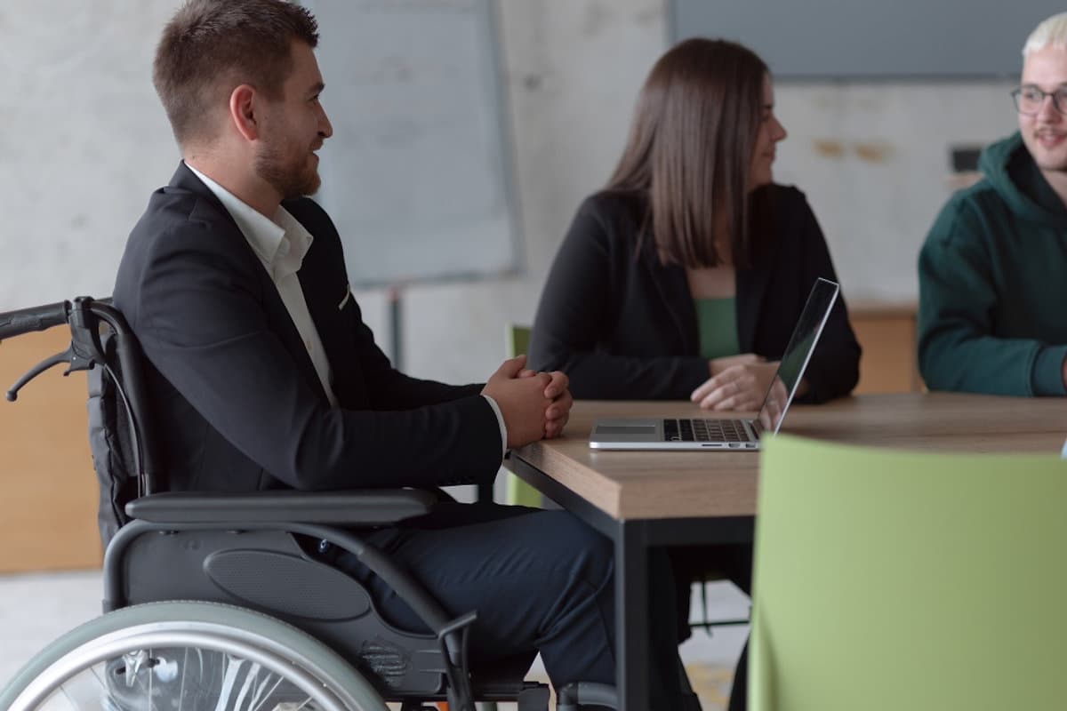 Disability support team reviewing service strategy